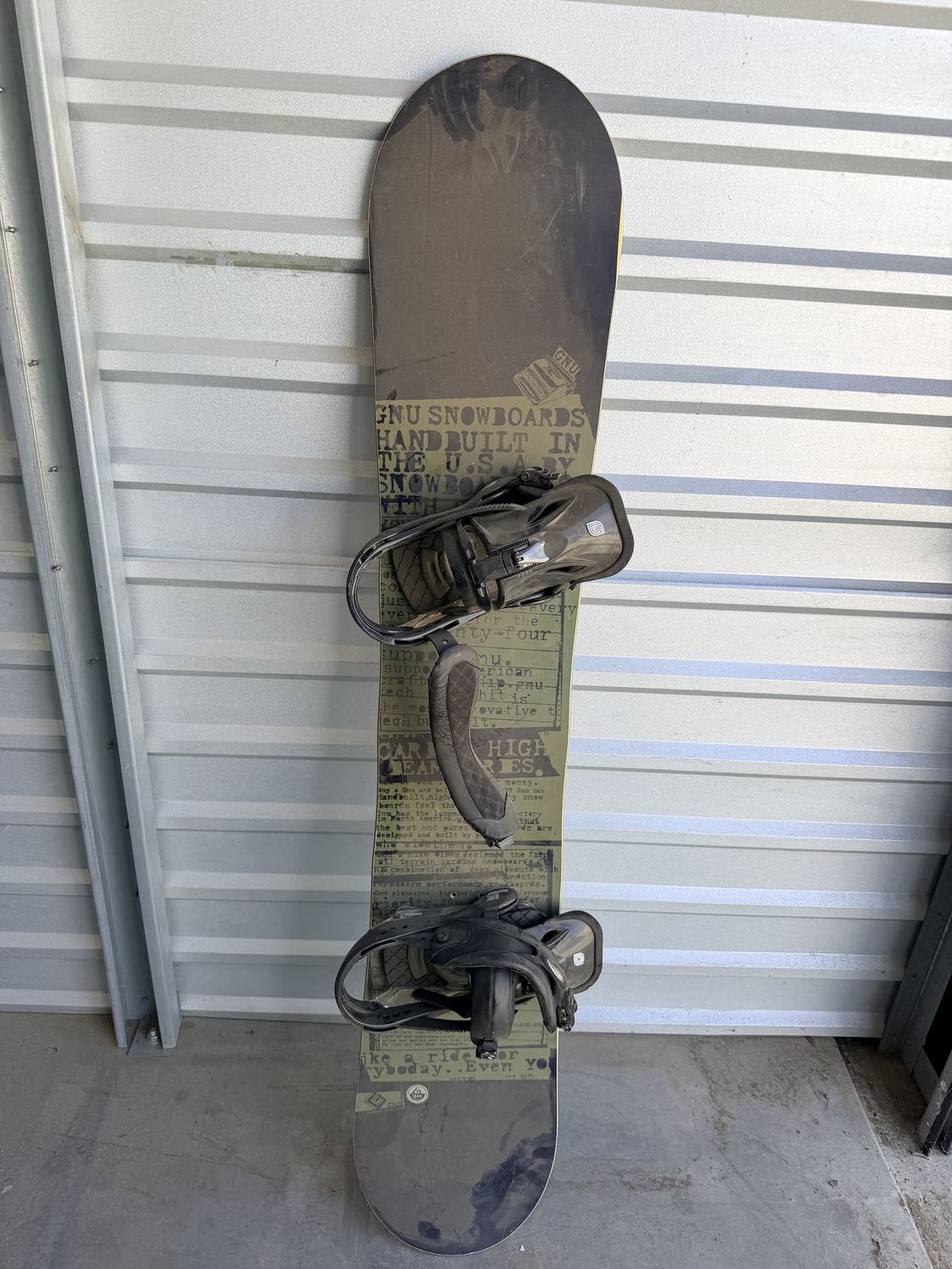A used snowboard with bindings