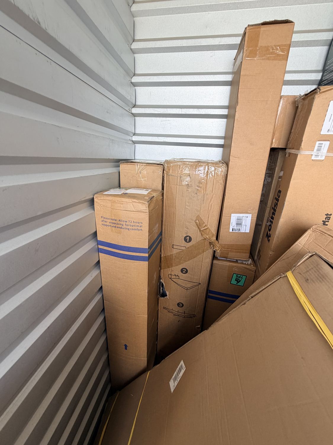 Shipping boxes stacked inside a storage unit